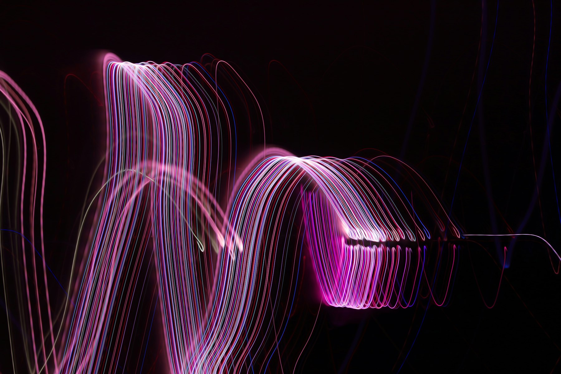 Long-exposure light trails on black